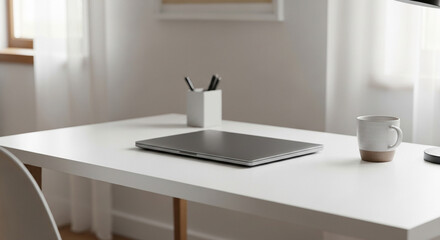 White desk with closed laptop pen holder and coffee mug office workspace