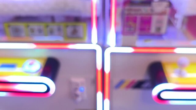 Blurred of chase LEDs on claw machine, indoor Chiangmai Thailand.