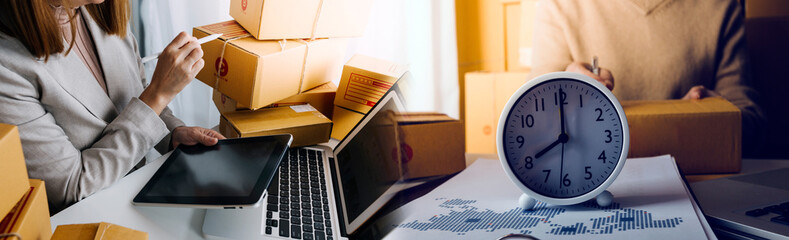 Online sales ideas for work at home. Asian man is answering phone calls. To accept orders from...