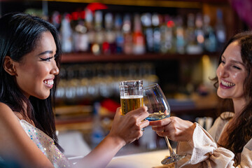 Two female friends enjoy a deep conversation over a glass of wine at a party or bar A concept for friendship social life and a girls night out