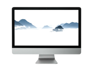 Modern monitor displaying a scenic mountain landscape filled with fog and misty sky