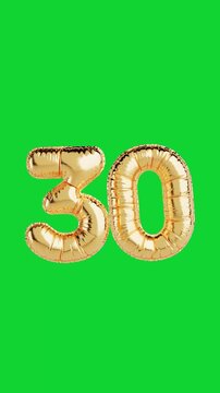 4k Resolution Vertical Video for Social Media: Anniversary Celebration Concept. Shiny Golden Balloon In Shape Of Number Thirty Moving On Green Screen Background With Alpha Matte