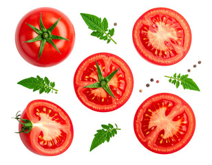 Red tomatoes, whole and sliced, arranged with green leaves, isolated against a dark background, overhead view