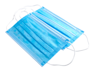 Three light blue surgical masks with white elastics are stacked on a dark background