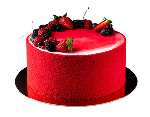 Red velvet cake adorned with fresh berries on a silver platter against a black background