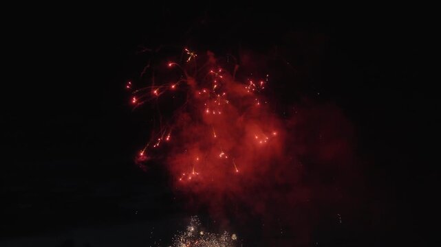 Celebration fireworks exploding in the sky. Slow motion