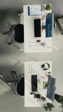 Vertical Video Top down view of business people consulting on budgeting and resource allocation during corporate event. Multinational company work team analyzes data for partnership and strategic