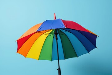 Obraz premium LGBT pride umbrella with rainbow colors displayed on a solid background, celebration, concept, pride