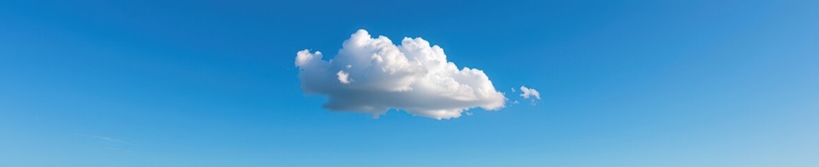 Obraz premium A solitary white cloud drifts peacefully in a vast, clear blue sky, symbolizing purity and serenity, pure, nature