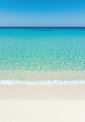 Fototapeta premium Crystal clear turquoise ocean water gently washing over pristine white sand on a tranquil beach, creating a seamless gradient of blue and white ,background ,calm ,fine