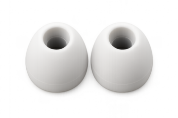 Pair of white silicone earbud tips on transparent background