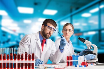 Team of scientists do biochemical research in lab