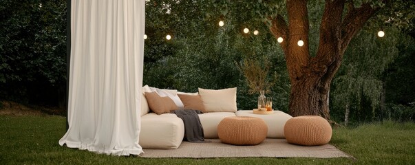 Stylish outdoor lounge area with cushions and warm lights for relaxation.