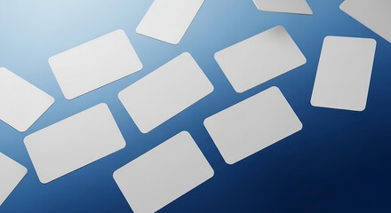 Blank White Cards Scattered on Blue Gradient Background.