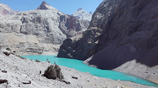 Big Allo lake view with mountain range and turquoise water in Fann mountains Pamir Alay Tajikistan