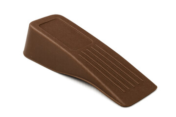 Brown plastic doorstop holding door in place