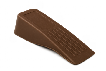 Brown plastic doorstop holding door in place
