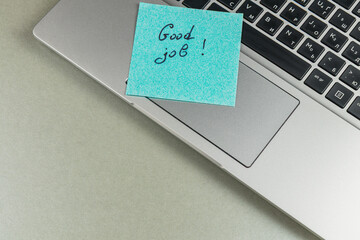 Encouraging note on laptop for motivation during work sessions
