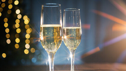 beam of light crashing into two champagne glasses