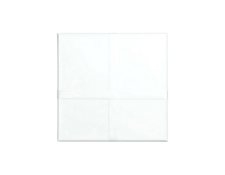 White folded paper sheet, slightly offset, on a black background with subtle shadows and visible fold lines