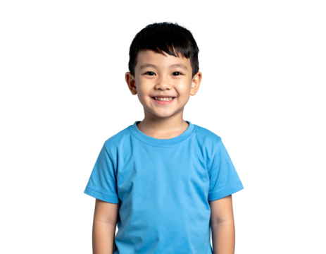 Smiling young boy, wearing a blue shirt against a solid black background, looking directly at the camera with joyful expression
