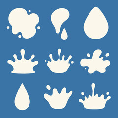 Obraz premium A collection of nine white milk splashes, drops, and crown splashes on a blue background.