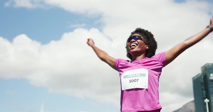 Running, winner and black woman celebrate for marathon achievement, finish and workout goals. Happy, excited and person outdoor with ribbon for exercise milestone, competition and success for race