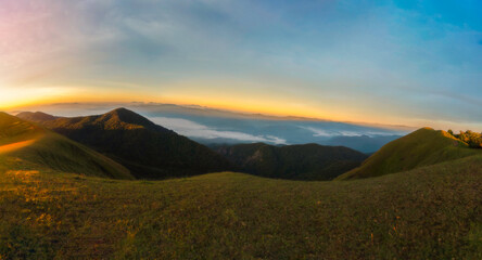 Mountain landscape at sunset. forest and green slopes