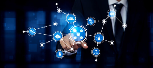 A businessman engages with an innovative technology interface, showcasing interconnected digital icons that represent various services and data interactions. Tessel