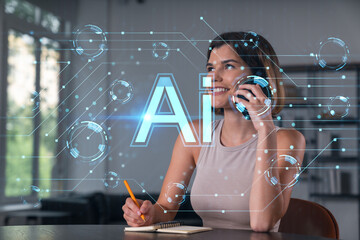 Smiling businesswoman in casual wear holding using smartphone typing at office workplace with notebook. Concept of distant work, business education. Ai icons hologram