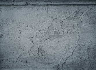 Monochrome grunge cracked concrete wall.