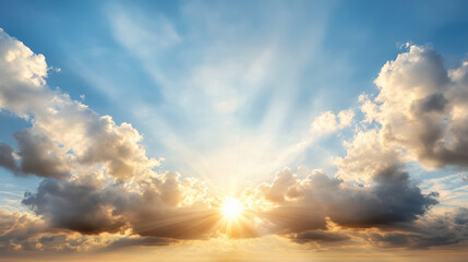 Fototapeta premium Bright sunlight beams through fluffy clouds, creating serene and dreamlike atmosphere