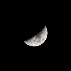 Beautiful half moon on the black sky background