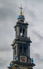 The iconic Westerkerk Tower in Amsterdam under a new cloudy sky