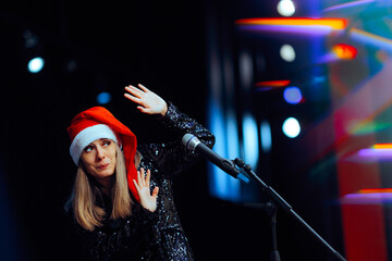 Christmas Woman Feeling Fearful receiving Booing off Stage. Public disapproval for a stage number gone wrong on holidays show 
