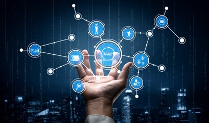 A human hand displays a digital interface featuring agile dynamics, emphasizing collaboration, technology, and innovative solutions in a modern business environment. Tessel