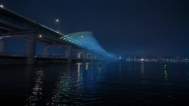 Banpo Bridge moonlight rainbow fountain illuminating Han River and Seoul cityscape at night