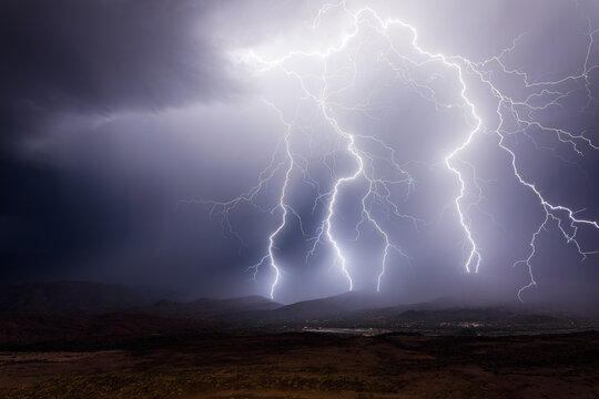 Lightning bolts strike from a severe thunderstorm