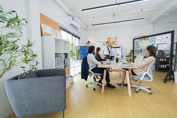 Business Professionals Discussing Project in Modern Office