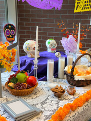 Colorful Altar Display for Día De Los Muertos Celebration Featuring Decorated Sugar Skulls and...