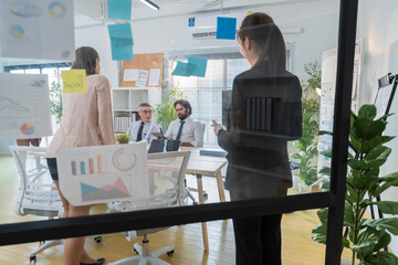 Business Professionals Discussing Project in Modern Office