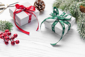 Christmas gifts wrapping on white wooden background