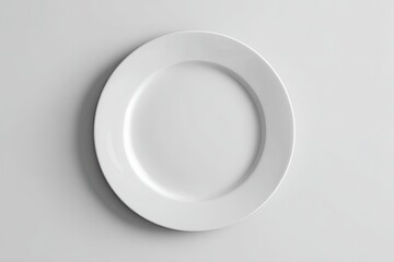 High-angle, overhead view of a blank, oval-shaped white plate