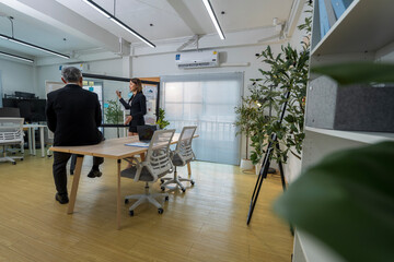 Business Professionals Discussing Project in Modern Office