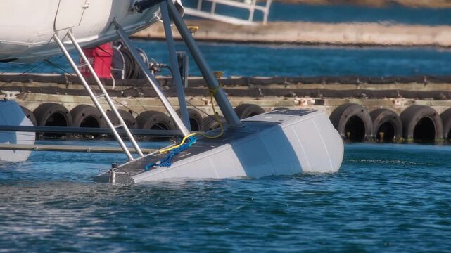 Close up of a seaplane departing from the harbour