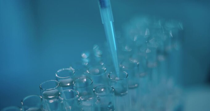 Test tube, science and pipette at lab with chemical, dropper and process for pharmaceutical solution. Fluid, medical research and study with tools, closeup and virus dna for vaccine development