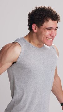 Fitness, man or scream in studio for motivation, training or workout on white background. Athlete, person and shout for power, emotional release or intense challenge with energy for preparation hype