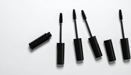 Obraz premium Unbranded mascara tube set PNG top view for makeup and beauty product mockups.