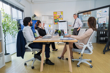 Business Professionals Discussing Project in Modern Office