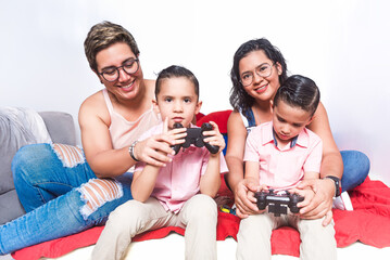 LGBTQ+ family playing video games together at home.